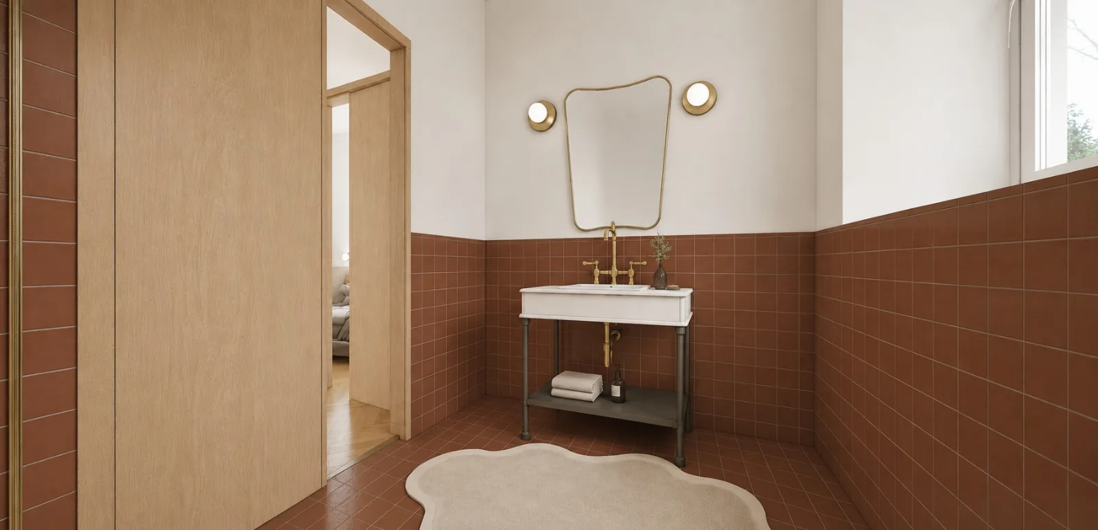Bagno finestrato con lavabo e specchiera con dettagli in ottone
