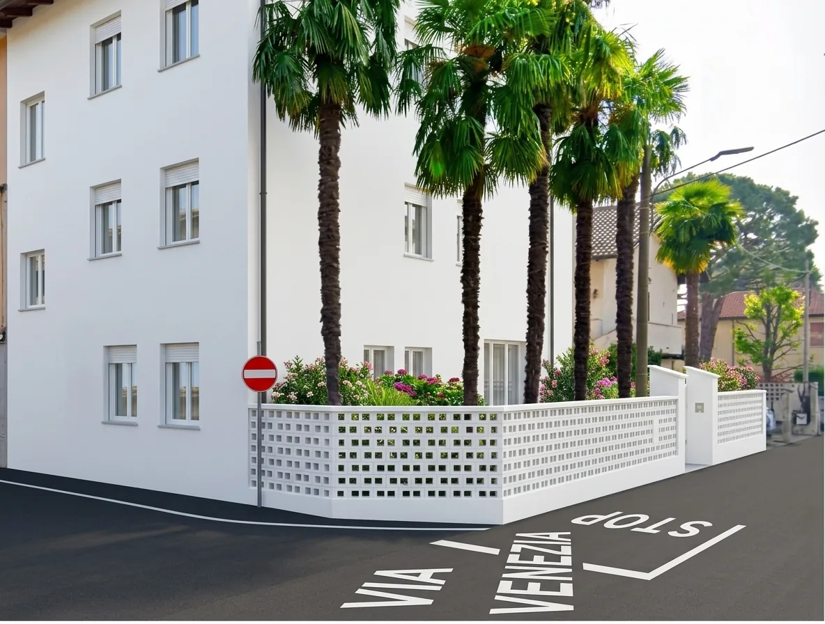 Palazzina bianca con giardino fiorito e palme all'angolo di via G. Candiani a Turate — render di progetto