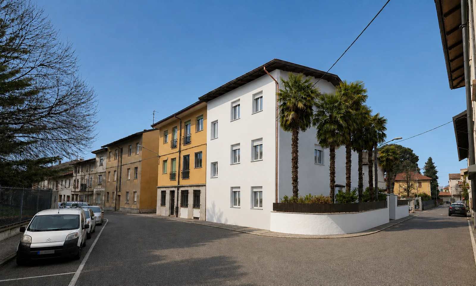 Bilocale con giardino privato in vendita a Turate — la palazzina all'angolo di via G. Candiani